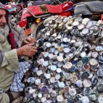 A vendor displaying different kind of wrist watches to attract the customers at Jinnah Bagh Chowk