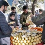 A vendor selling guava and orange to customers at Aabpara in Federal Capital