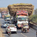 Truck holders on the way loaded with sugarcanes at flyover of Tando Yousuf