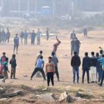 Youngsters playing cricket at local ground in the Federal Capital