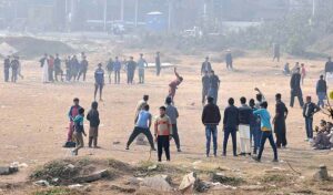 Youngsters playing cricket at local ground in the Federal Capital