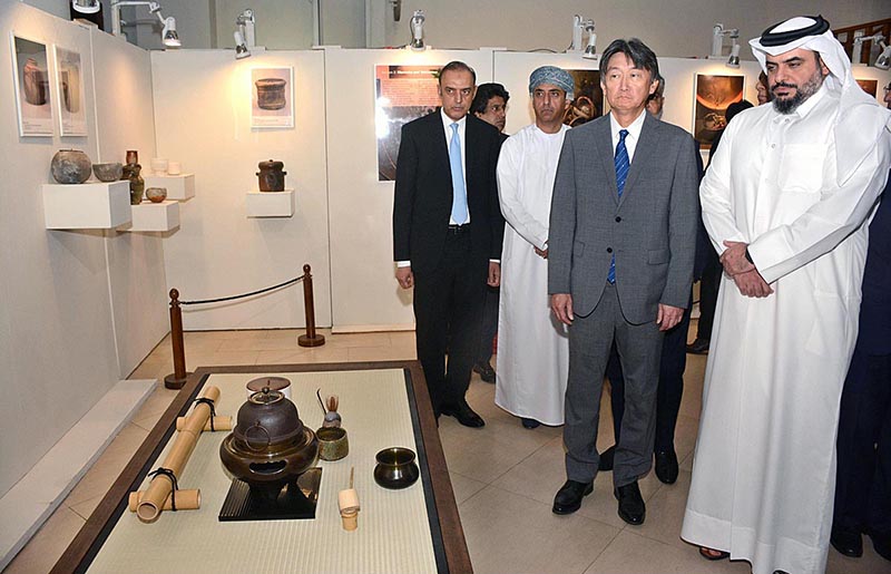 Visitors watching traditional pottery and ceramic pieces displayed in Exhibition 'Yakishime, Earth Metamorphosis' at SBP Museum