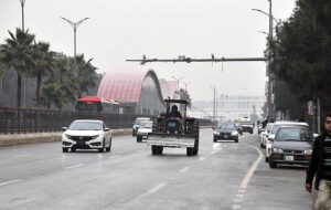 Vehicles on the way during light showers that experienced Federal Capital.