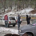 People capture the moment with their cell phones during first snowfall of the season.