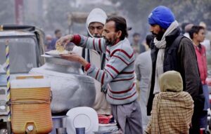 A vendor selling "Rice Pulao" on his hand cart setup. 