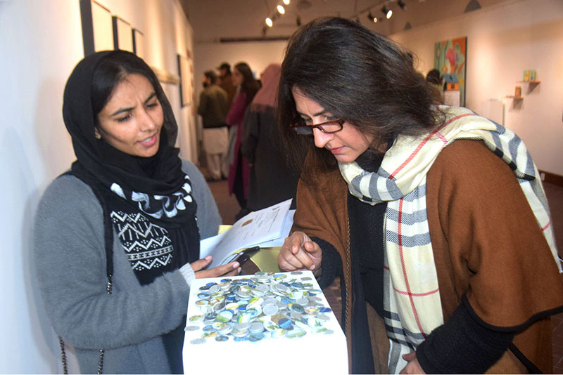 Visitors viewing the displayed art stuff during Art exhibition of Degree Show 2023 at NCA