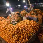 A vendor waiting for customers to sell oranges at KhanaPul.