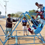 Children enjoying the swing at Kumhar Para