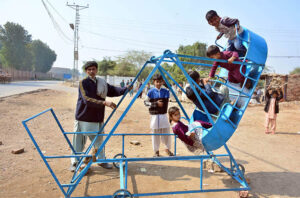 Children enjoying the swing at Kumhar Para