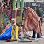 An elderly woman vendor selling shopping bags at Weekly Bazaar in Federal Capital
