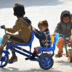 Children enjoying bicycle riding on the road.
