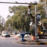 A worker is busy in the maintenance work of CCTV cameras installed in Federal Capital