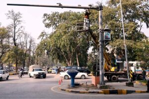 A worker is busy in the maintenance work of CCTV cameras installed in Federal Capital
