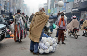 A vendor is selling footballs at Katchery bazaar.