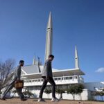 An attractive view of the famous Faisal Masjid with a clear blue sky in the background after a light shower in the Federal Capital
