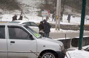 People capture the moment with their cell phones during first snowfall of the season.