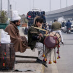 Traditional drummers sitting on the roadside while waiting for clients to be hired for functions at Marrir Chowk neighborhood