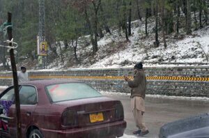 People capture the moment with their cell phones during first snowfall of the season.