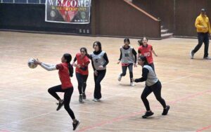 Players of KGS and PAF netball teams in action during National Inter School Girls Netball Championship Final at Liaqat Gymnasium