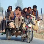 An underage rider with Family riding a motorcycle cart loader at Jaranwala Road which may cause a mishap and needs the attention of concerned authorities.