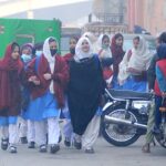 Students returning home after attending school, Govt announced to reopen the schools with changed timing after winter vacation.