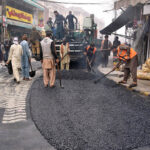 Heavy machinery is being used for carpeting on old Anarkali Main Road