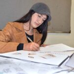 Student of Pakistan Institute of Fashion and Design finalizing her project.