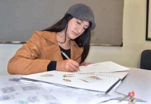 Student of Pakistan Institute of Fashion and Design finalizing her project. 