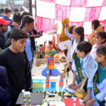 Visitors viewing the project models made by students during the Science and Art Exhibition at Public School.