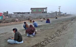 Labourers are busy in construction work of Bhalwal to Salam Interchange Road during development work