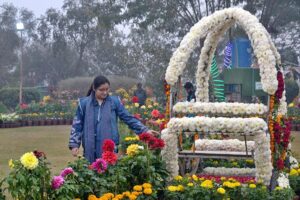 Visitor taking a keen interest in flowers during the annual Gul Dawoodi flower show at Qila Kuhna Qasim Bagh