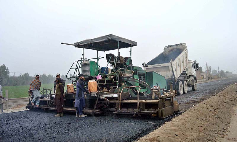 Labourers are busy in construction work of Bhalwal to Salam Interchange Road during development work