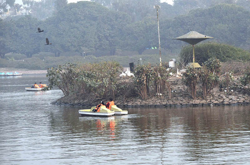 People enjoy boat ride in Gulshan-e-Iqbal Park