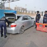 Police officials busy searching vehicles during routine security check in the Federal Capital