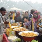 Students are visiting different food stalls during Gur Mela at the University of Agriculture Faisalabad organized by Directorate of Farms.