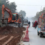 Labourers busy in construction work of Park Road with the help of heavy machineries during development work in the city