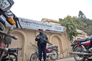 Police officials busy searching vehicles during routine security check in the Federal Capital