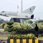 PDA worker busy in watering plants at Hayatabad Jahaz Chowk.