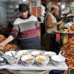 A shopkeeper selling “doodh jalebi” in a local market of Federal Capital.