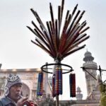 A vendor displaying traditional musical instrument “bansuri” to attract the customers in a local market.