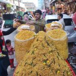 A vendor sells food item to a customer at Fawara Chowk.
