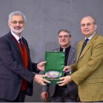 Mr.Justice Syed Mansoor Ali Shah presenting a copy of FJA Vision to Hon'ble Chief Justice of Pakistan, Mr Justice Qazi Faez Isa in the Conference on the Launch of Vision and E-Campus at the Federal Judicial Academy