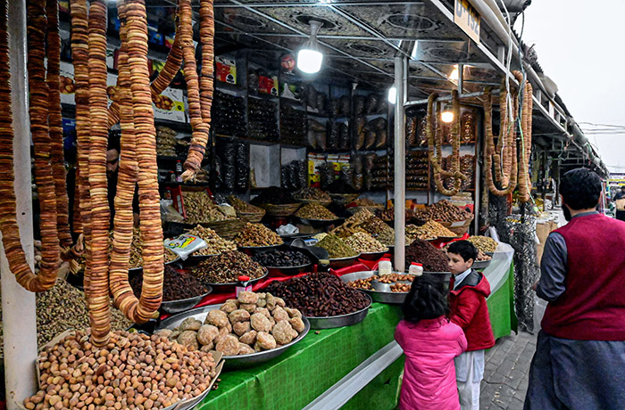 Vendors displaying dry fruits to attract the customers at weekly Bazaar.