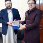 Principal Secretary to the President and renowned writer Muhammad Shakeel Malik presents his book ‘Bey-Ehtiatian’ to Chief Minister Gilgit-Baltistan, Gulbar Khan at GB House
