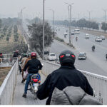 A large number of Motorcyclists crossing the bridge at Srinagar Highway in the Federal Capital.