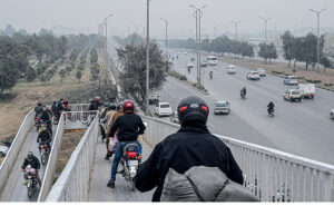 A large number of Motorcyclists crossing the bridge at Srinagar Highway in the Federal Capital.