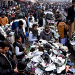 A large number of people selecting and purchasing second hand warm clothes and other stuff from the vendors at Landa Bazar.