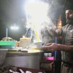 A vendor displaying chicken soup to attract the customers at his roadside setup during winter season in the Provincial Capital.