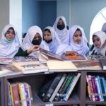 Students from different schools taking keen interest in books during visits to Garrison Public Library.