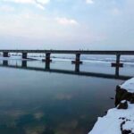 An attractive and eye catching view of Snow covered RCC Bridge along with Indus River during first snow fall in the catchment area of Pakistan.